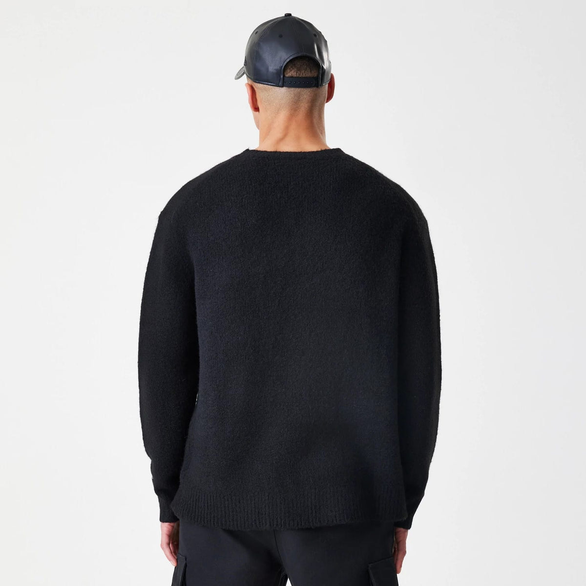 The Male model is wearing New Era Knit Black Knitted Sweater 2