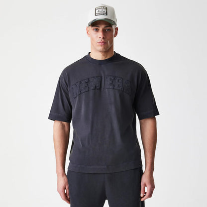 The Male model is wearing  New Era Washed Black Oversized T-Shirt 3