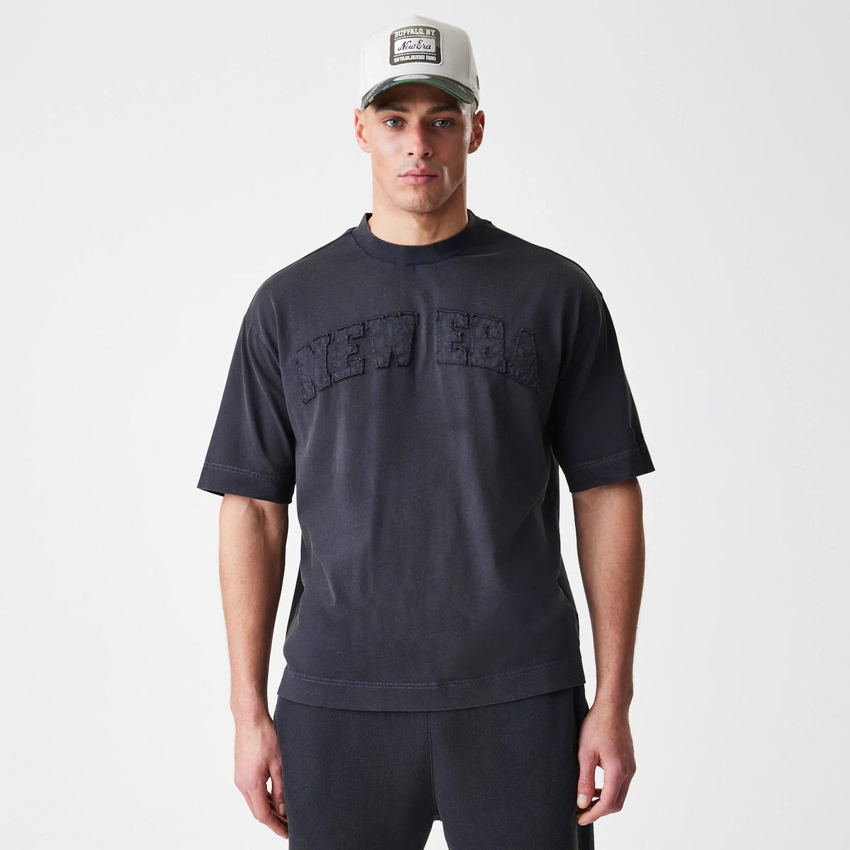 The Male model is wearing  New Era Washed Black Oversized T-Shirt 3