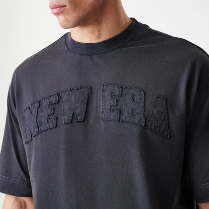 The Male model is wearing  New Era Washed Black Oversized T-Shirt 5