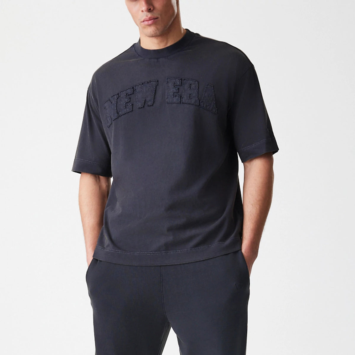 The Male model is wearing  New Era Washed Black Oversized T-Shirt 6