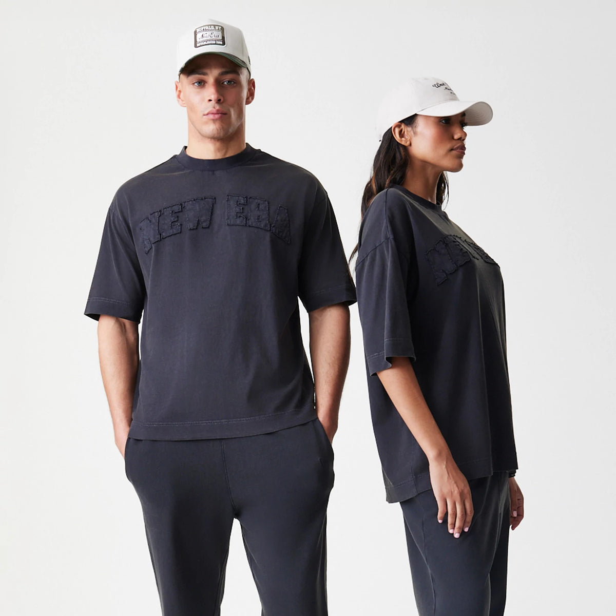 The Male model is wearing  New Era Washed Black Oversized T-Shirt 8