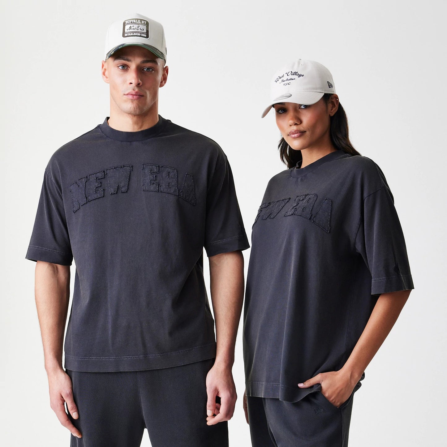 The Male model is wearing  New Era Washed Black Oversized T-Shirt 1