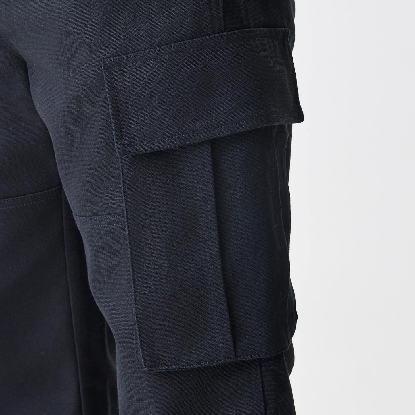 The Male model is wearing  New Era Cargo Black Straight Leg Trousers 4