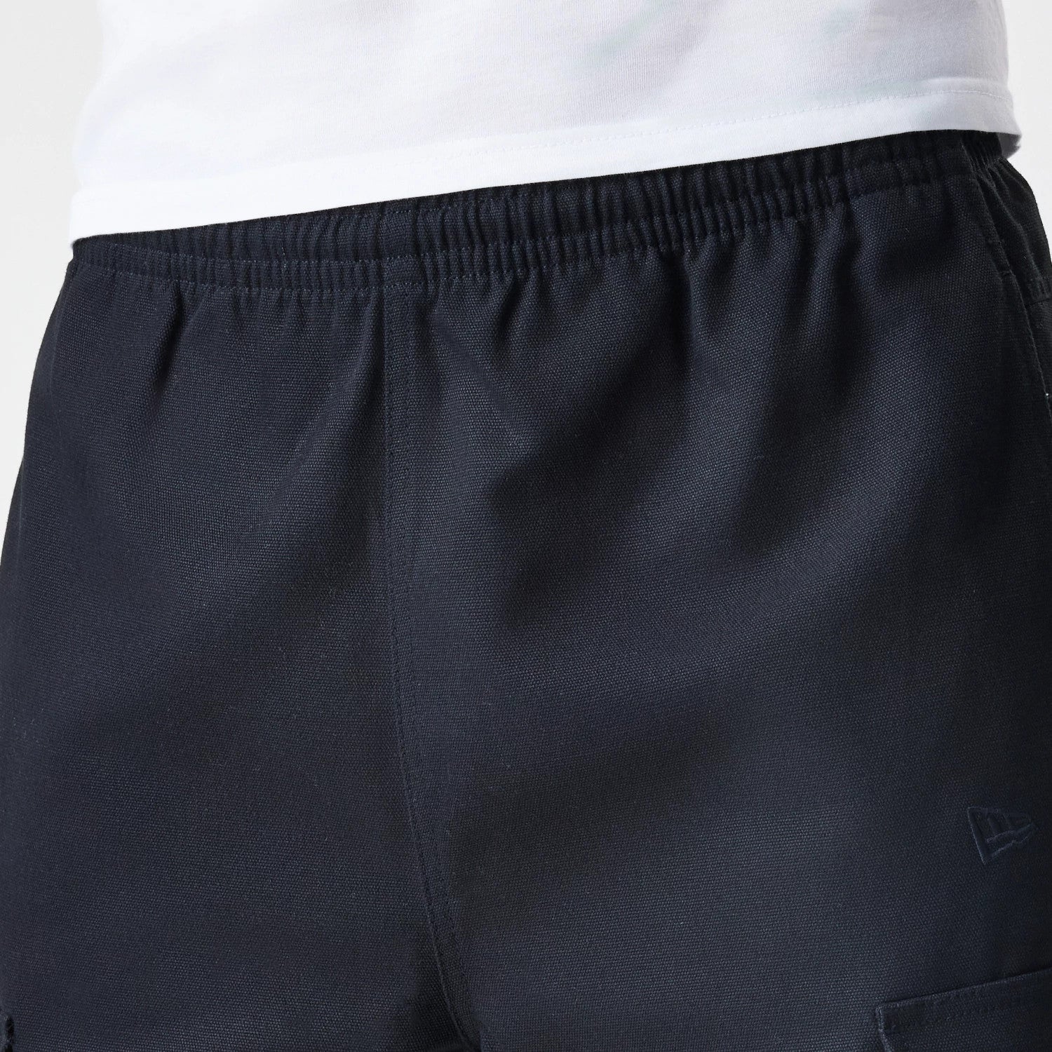 The Male model is wearing  New Era Cargo Black Straight Leg Trousers 6