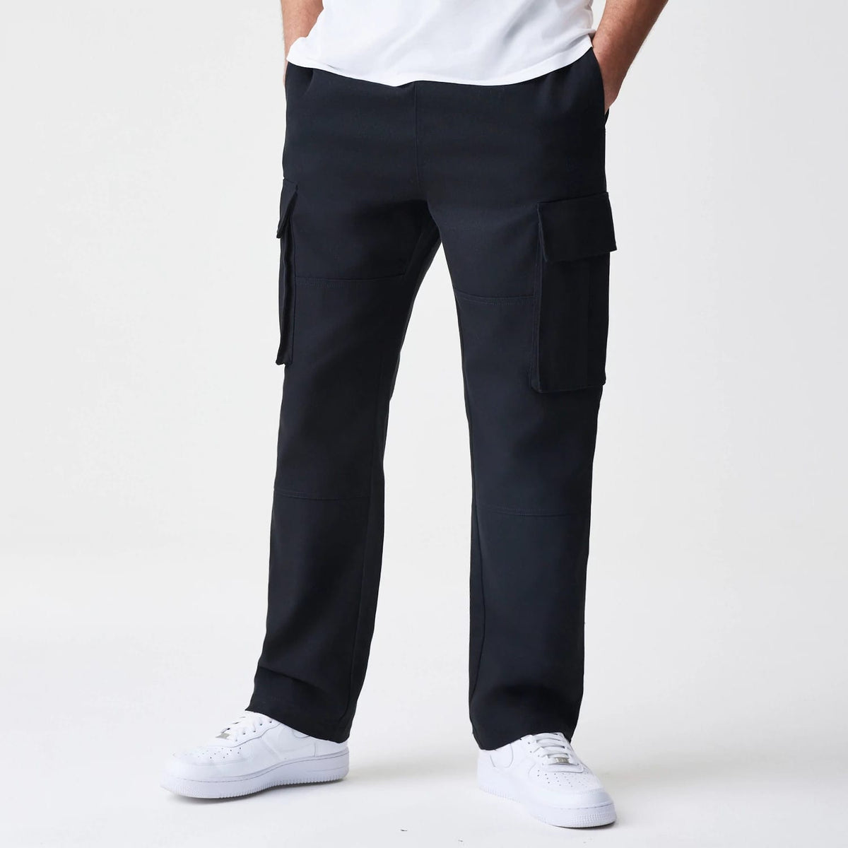 The Male model is wearing  New Era Cargo Black Straight Leg Trousers 1
