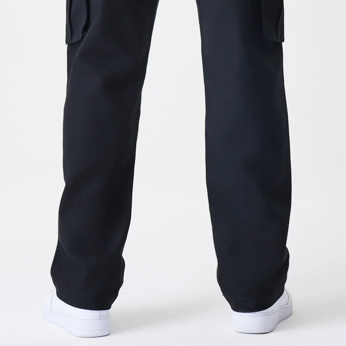 The Male model is wearing  New Era Cargo Black Straight Leg Trousers 7