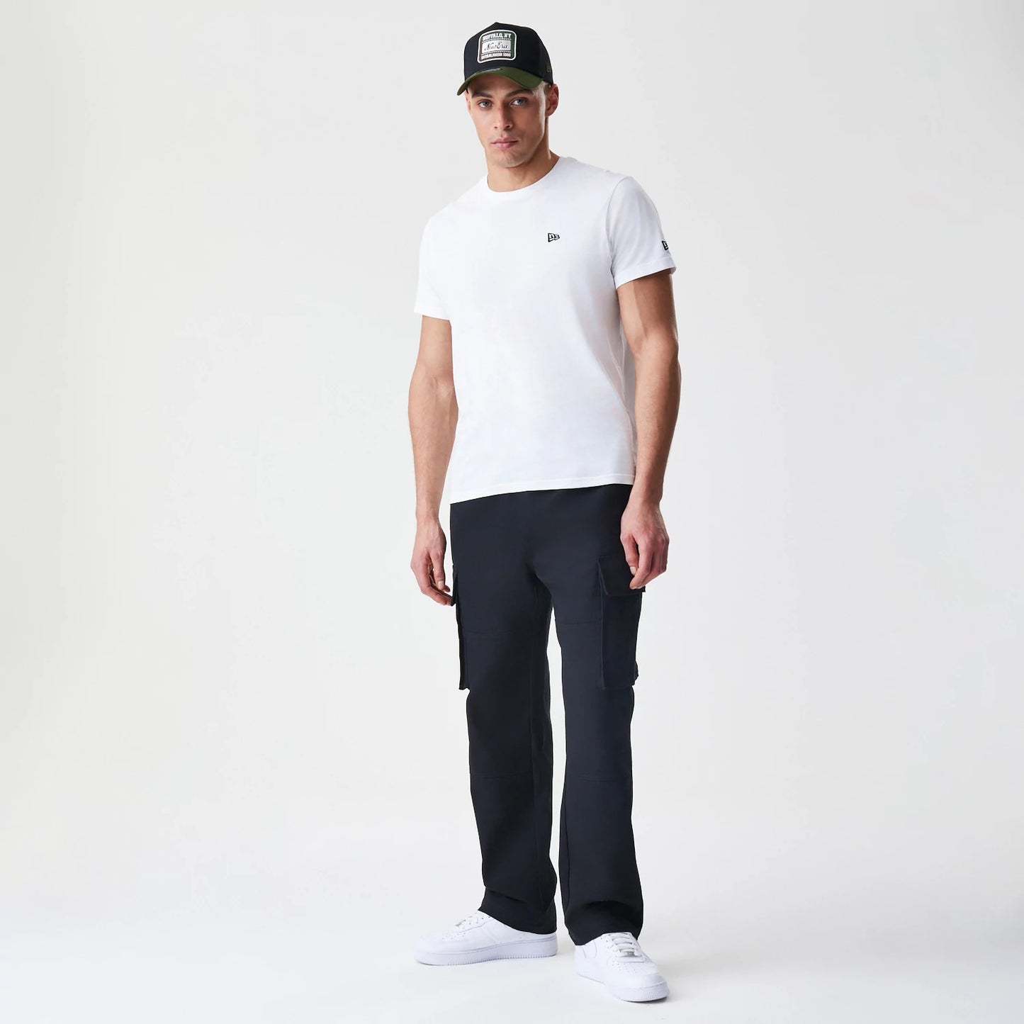 The Male model is wearing  New Era Cargo Black Straight Leg Trousers 8