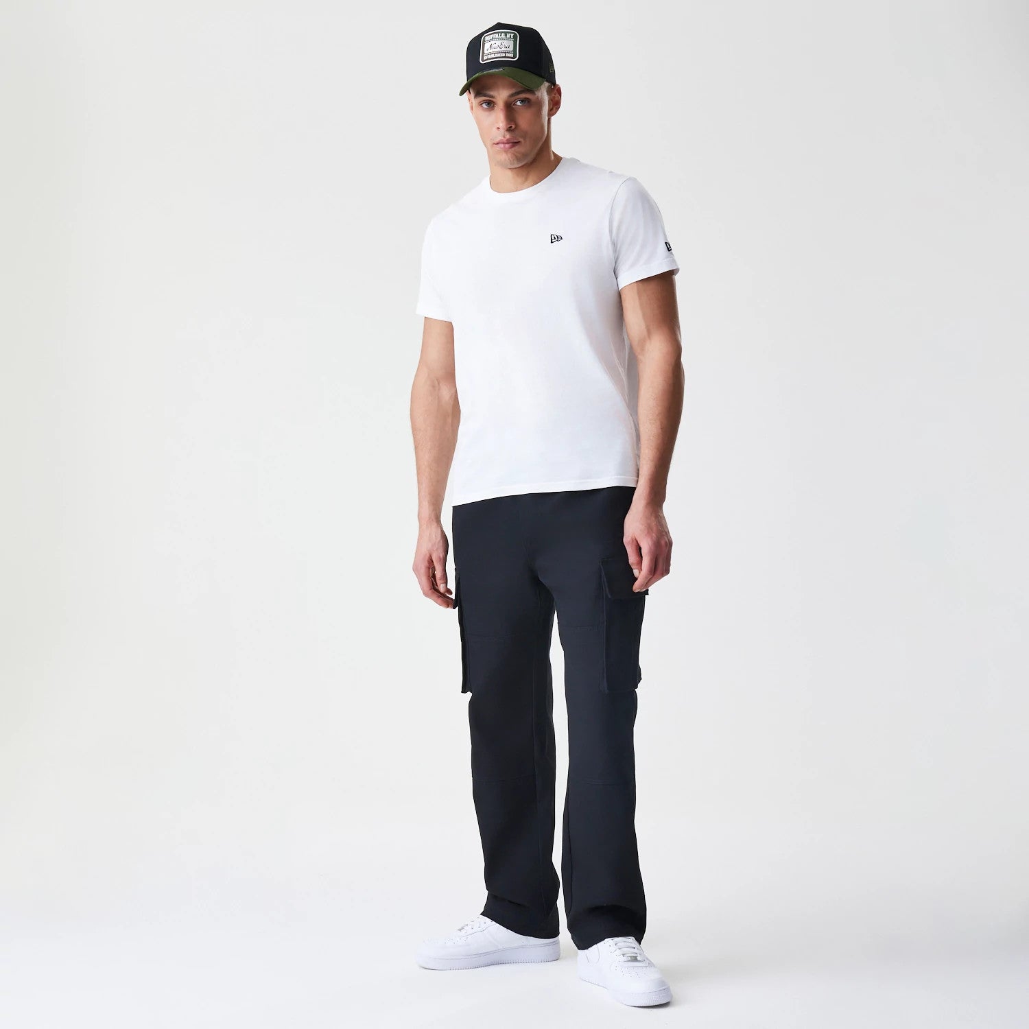 The Male model is wearing  New Era Cargo Black Straight Leg Trousers 8