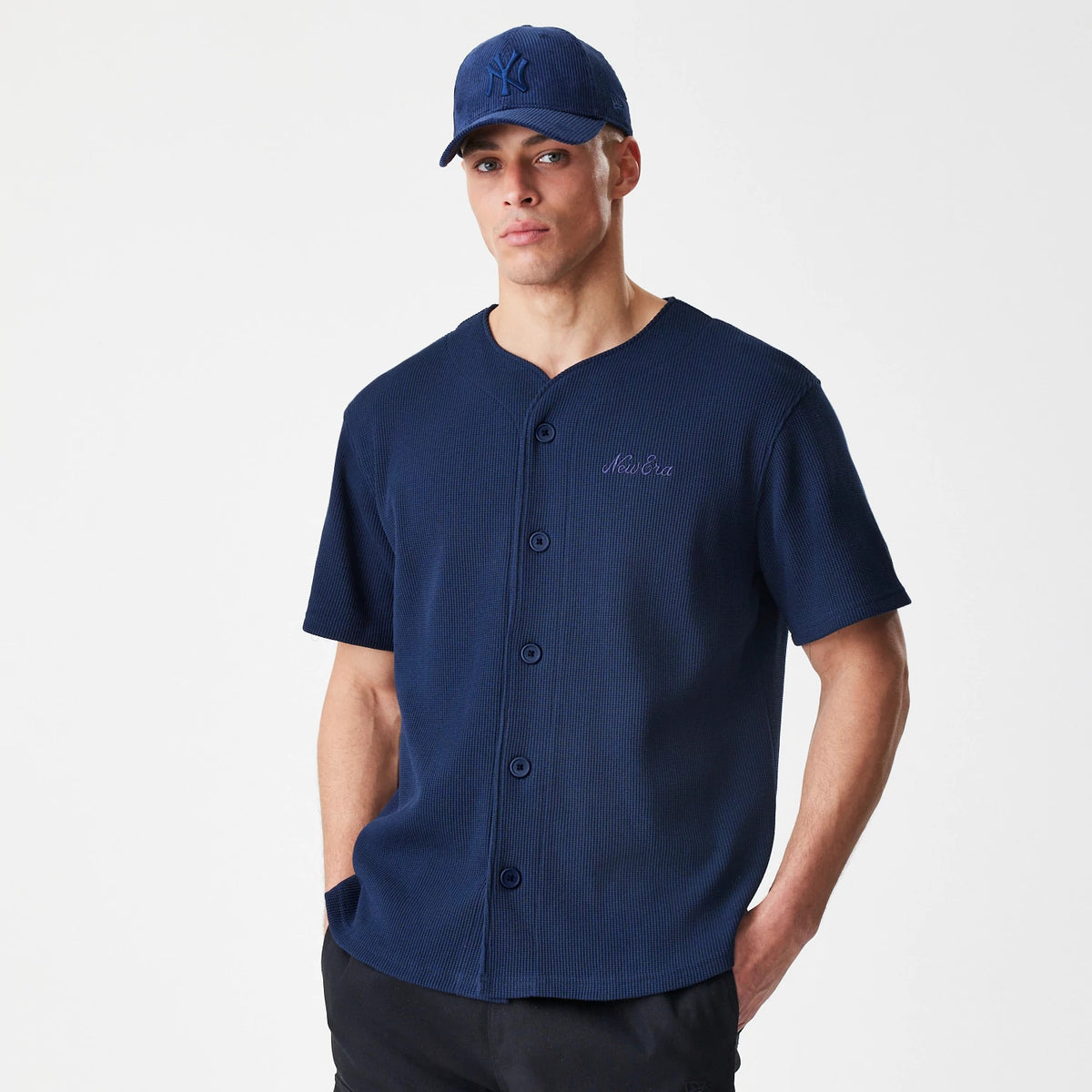 The Male model is wearing  New Era Waffle Navy Jersey 3