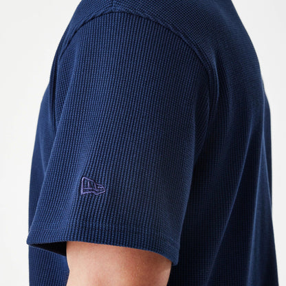 The Male model is wearing  New Era Waffle Navy Jersey 7