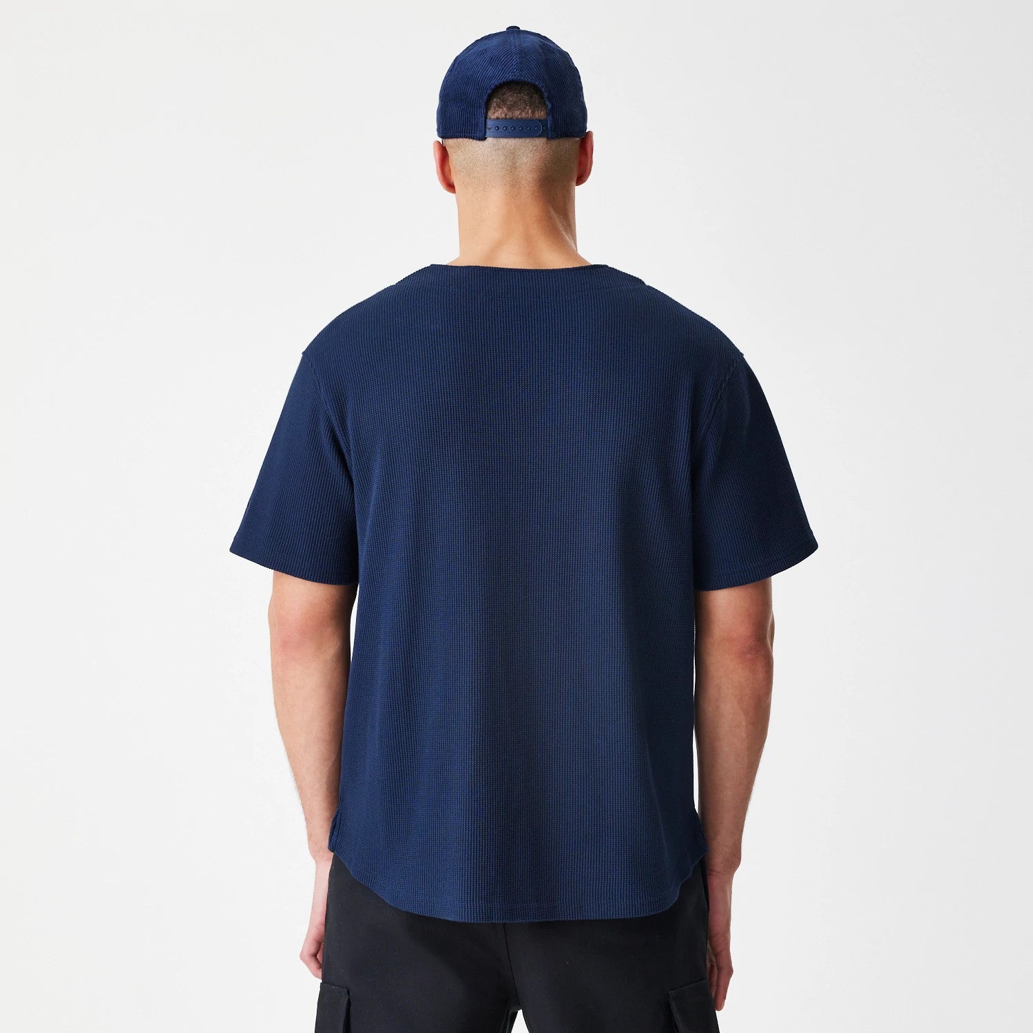 The Male model is wearing  New Era Waffle Navy Jersey 2