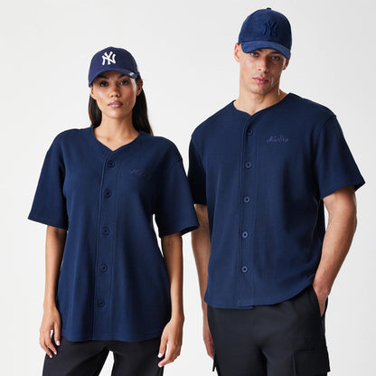 The Male model is wearing  New Era Waffle Navy Jersey 1
