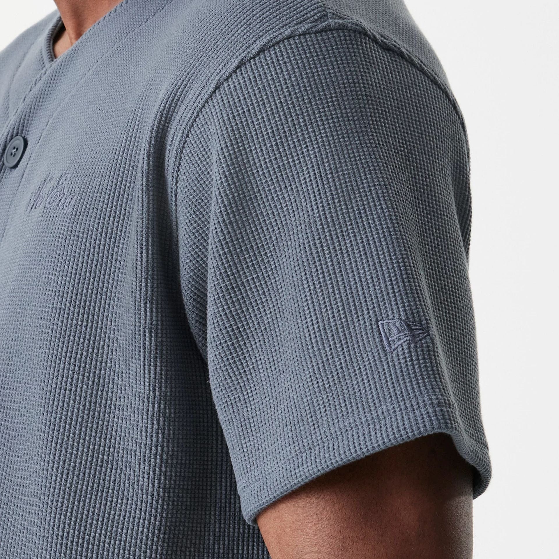 The Male model is wearing  New Era Waffle Dark Grey Jersey  8