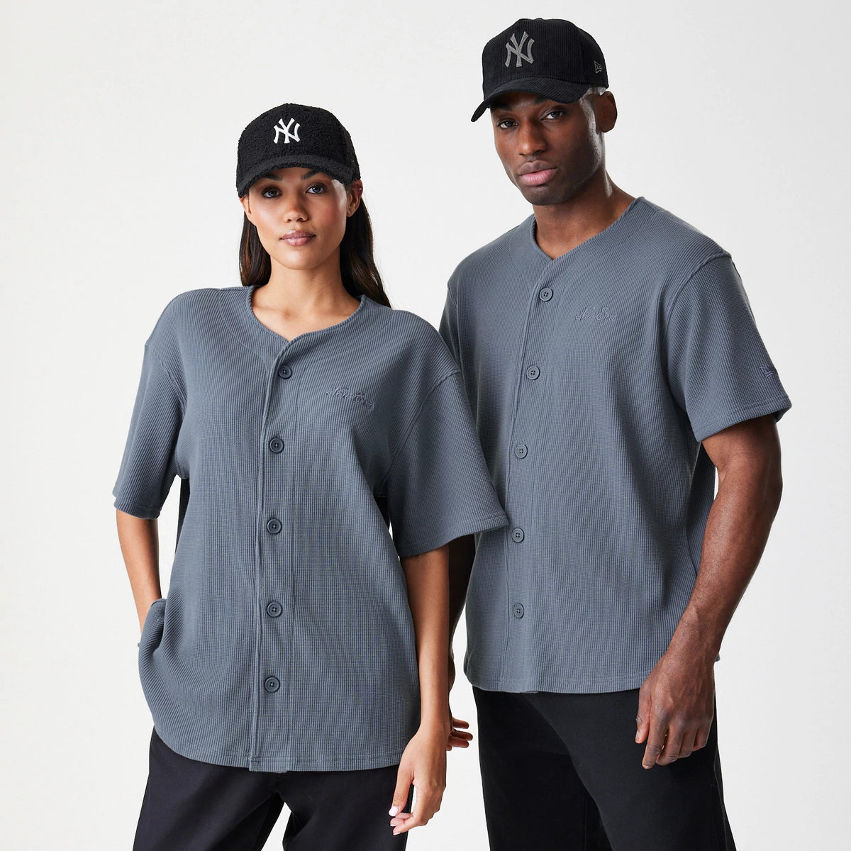 The Male model is wearing  New Era Waffle Dark Grey Jersey 1