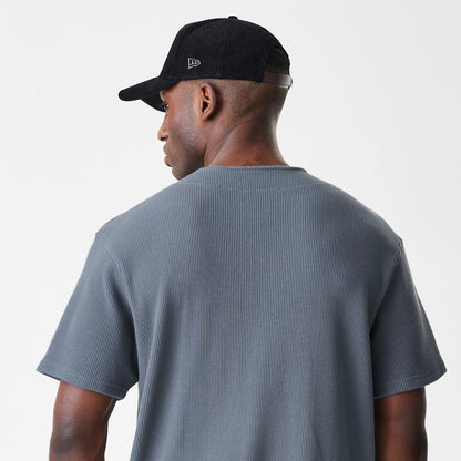 The Male model is wearing  New Era Waffle Dark Grey Jersey 5