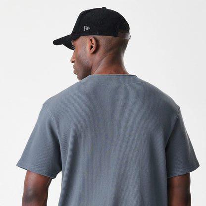 The Male model is wearing  New Era Waffle Dark Grey Jersey 5