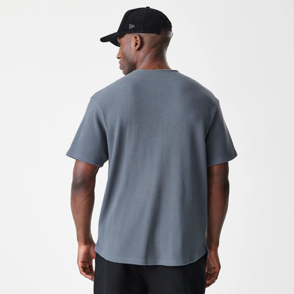 The Male model is wearing  New Era Waffle Dark Grey Jersey 2