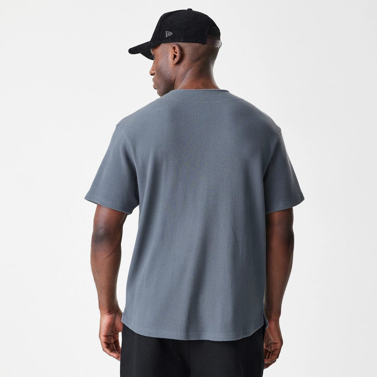 The Male model is wearing  New Era Waffle Dark Grey Jersey 2