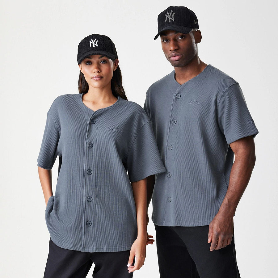 The Male model is wearing  New Era Waffle Dark Grey Jersey  1