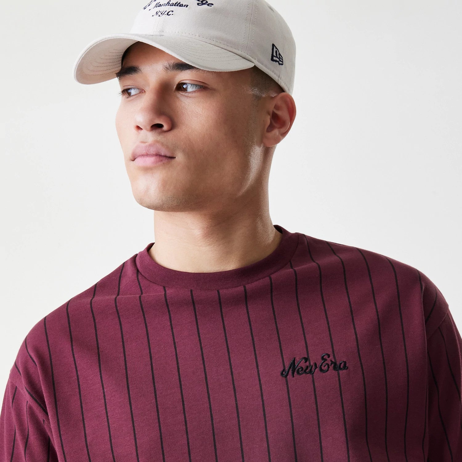 The Male model is wearing  New Era Pinstripe Dark Red Oversized T-Shirt 4