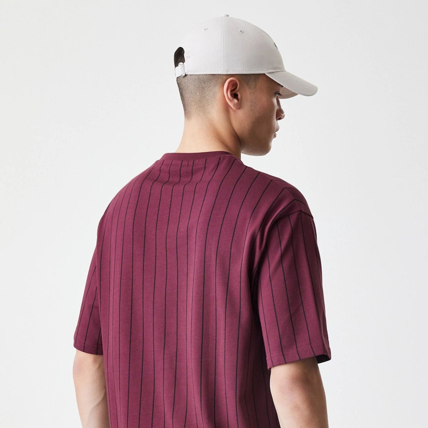 The Male model is wearing  New Era Pinstripe Dark Red Oversized T-Shirt  7