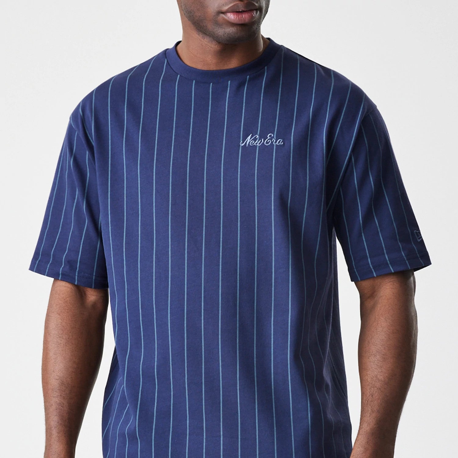 The Male model is wearing  New Era Pinstripe Navy Oversized T-Shirt 3