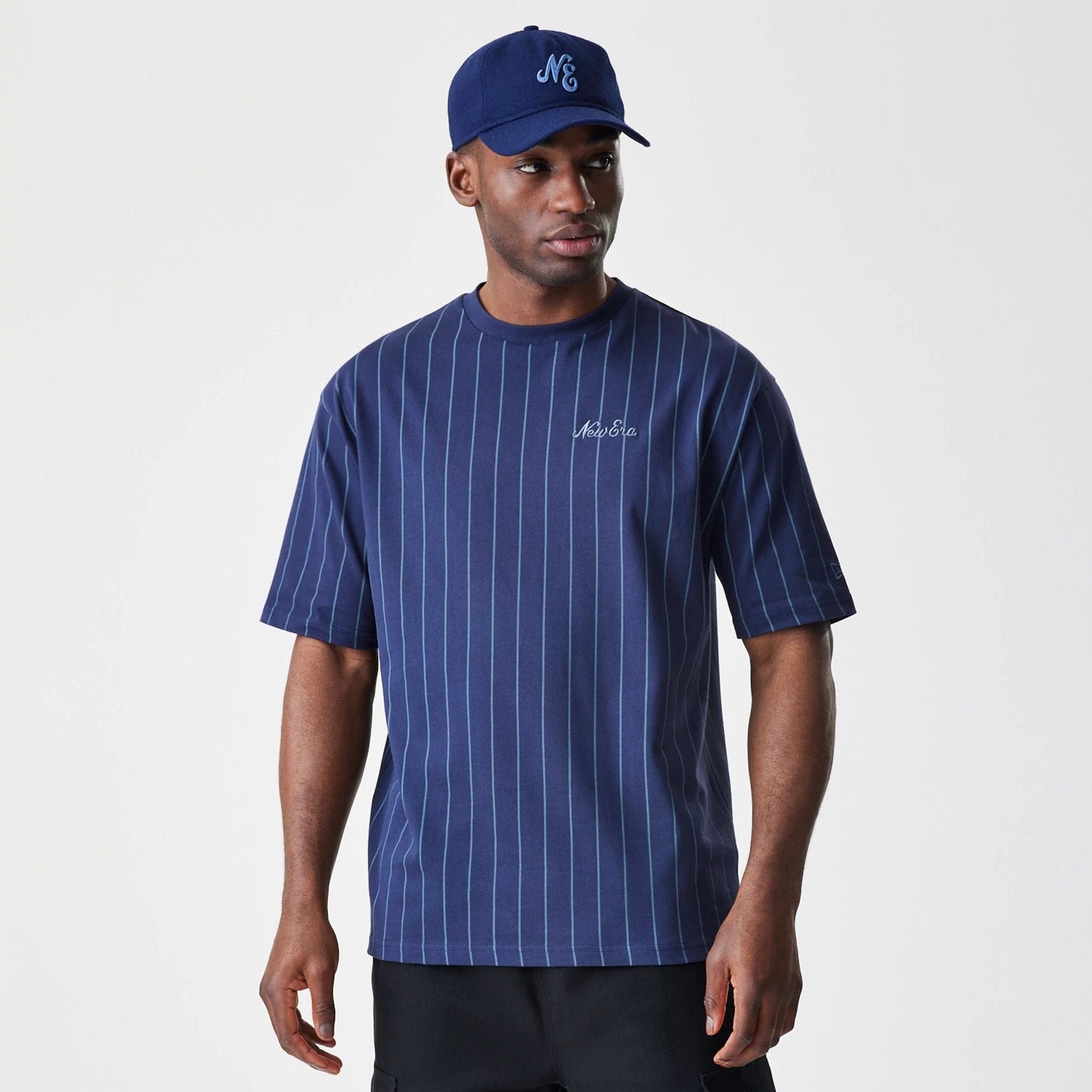 The Male model is wearing  New Era Pinstripe Navy Oversized T-Shirt  1