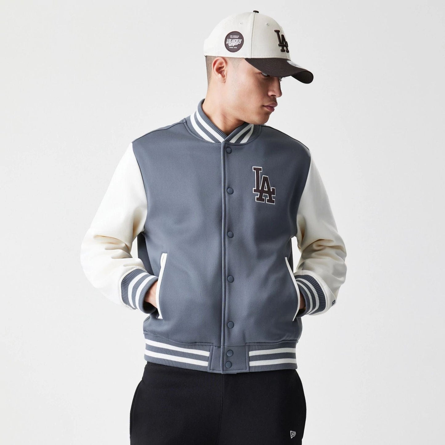 The Male model is wearing LA Dodgers MLB Dark Grey Varsity Jacket  1