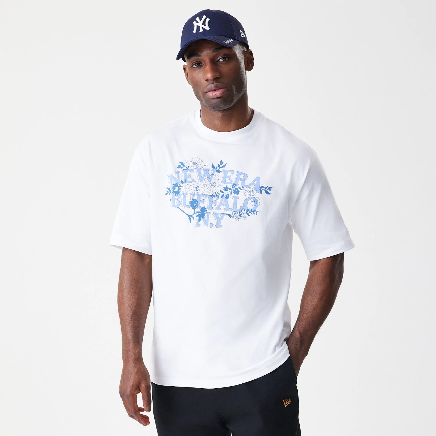 The Male model is wearing  New Era Floral White Oversized T-Shirt 3