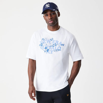 The Male model is wearing  New Era Floral White Oversized T-Shirt 3