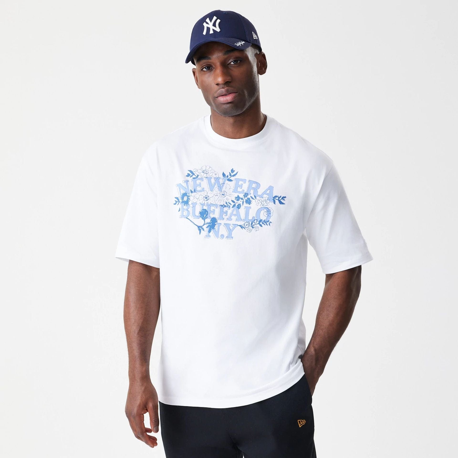 The Male model is wearing  New Era Floral White Oversized T-Shirt  3