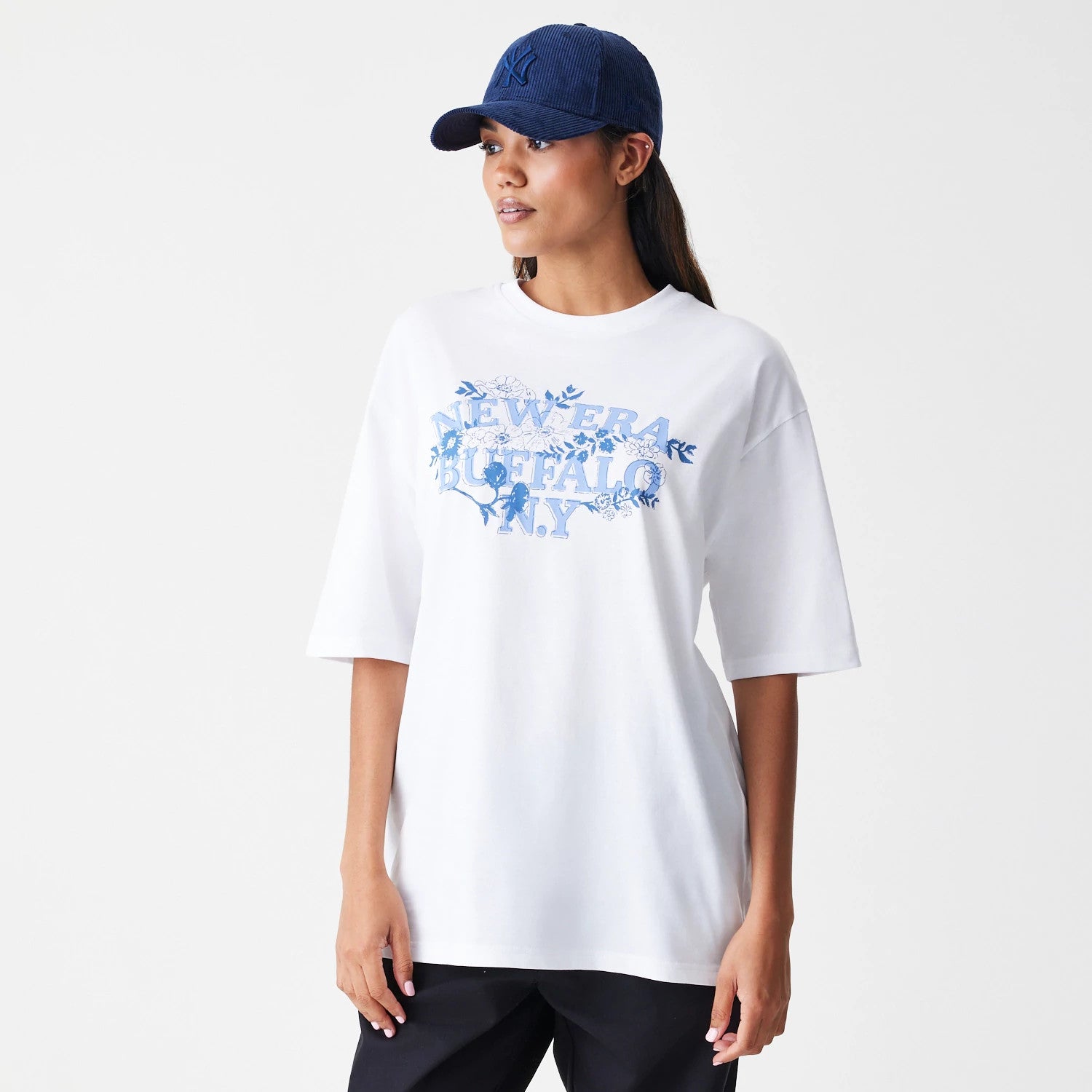 The Male model is wearing  New Era Floral White Oversized T-Shirt 4