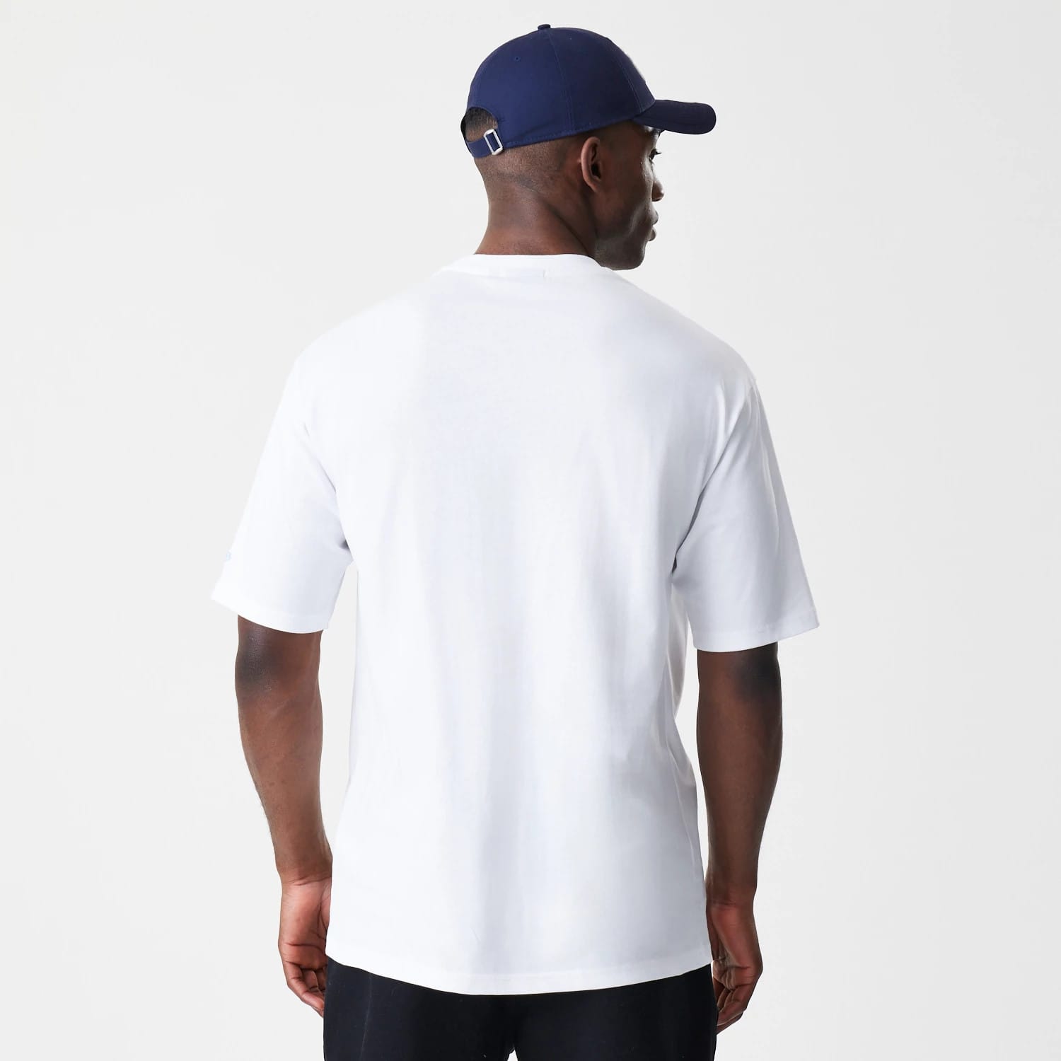 The Male model is wearing  New Era Floral White Oversized T-Shirt 2