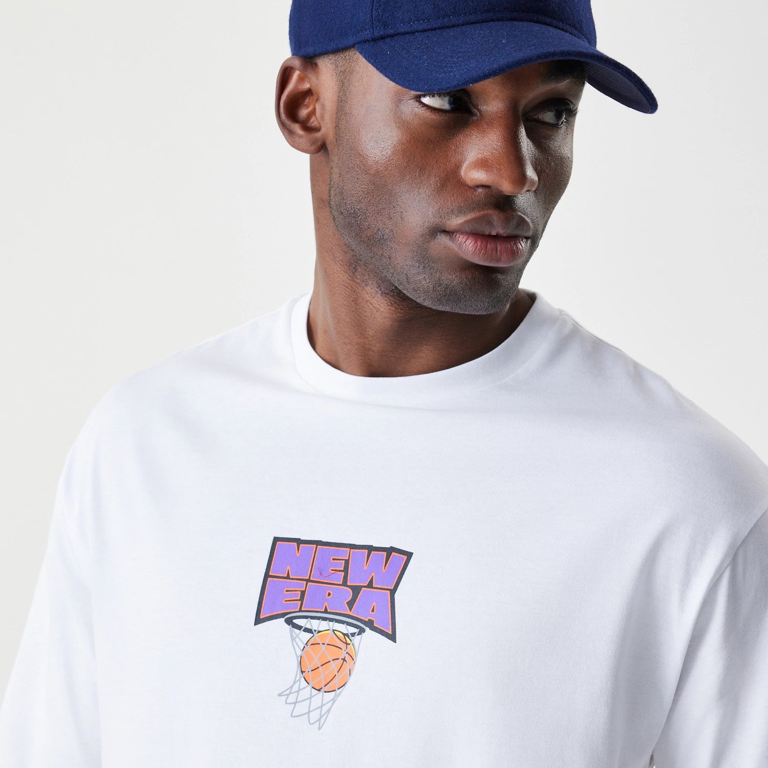 The Male model is wearing  New Era Location White Oversized T-Shirt 6