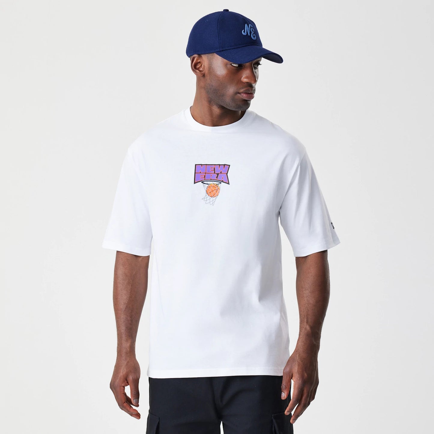The Male model is wearing  New Era Location White Oversized T-Shirt 1