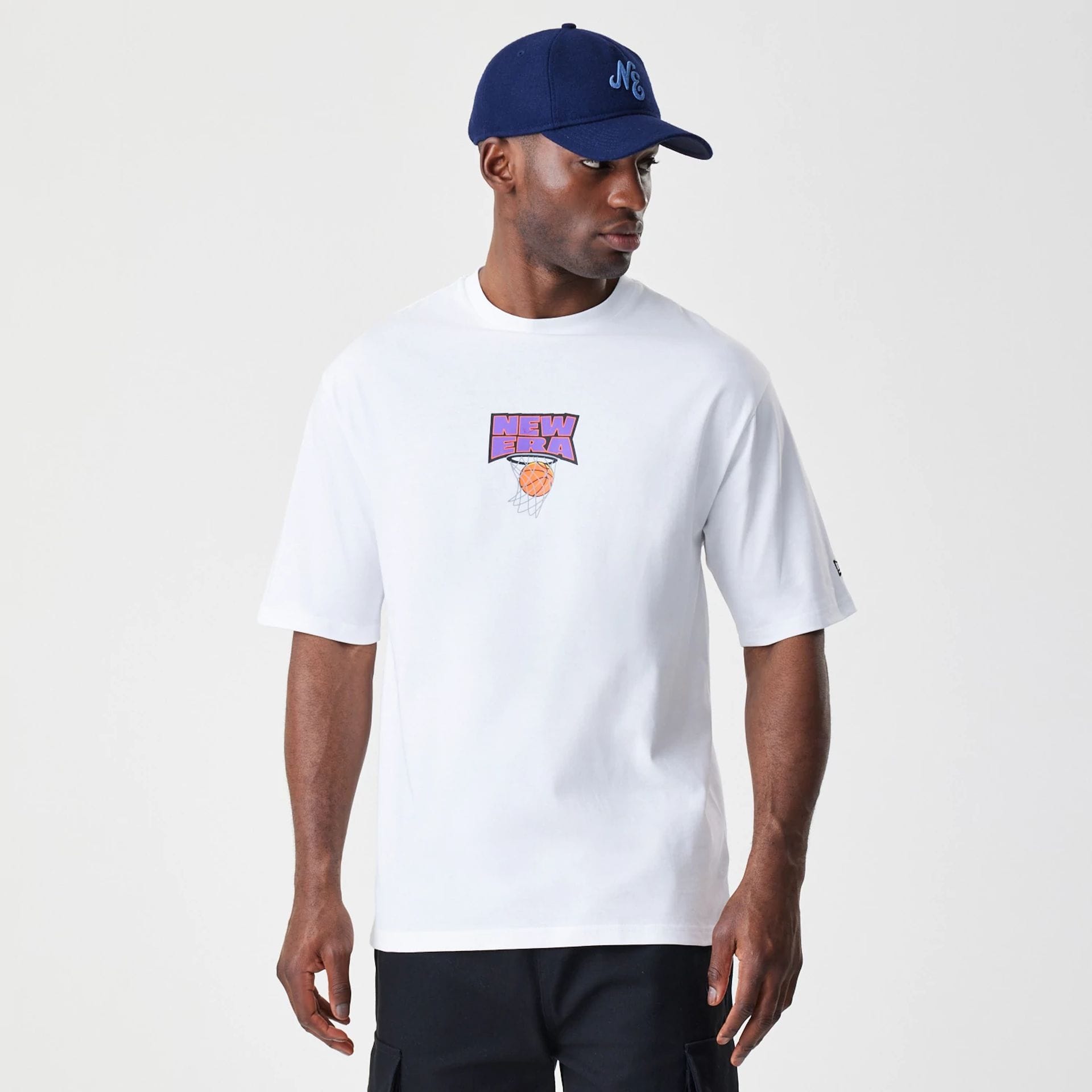 The Male model is wearing  New Era Location White Oversized T-Shirt 1