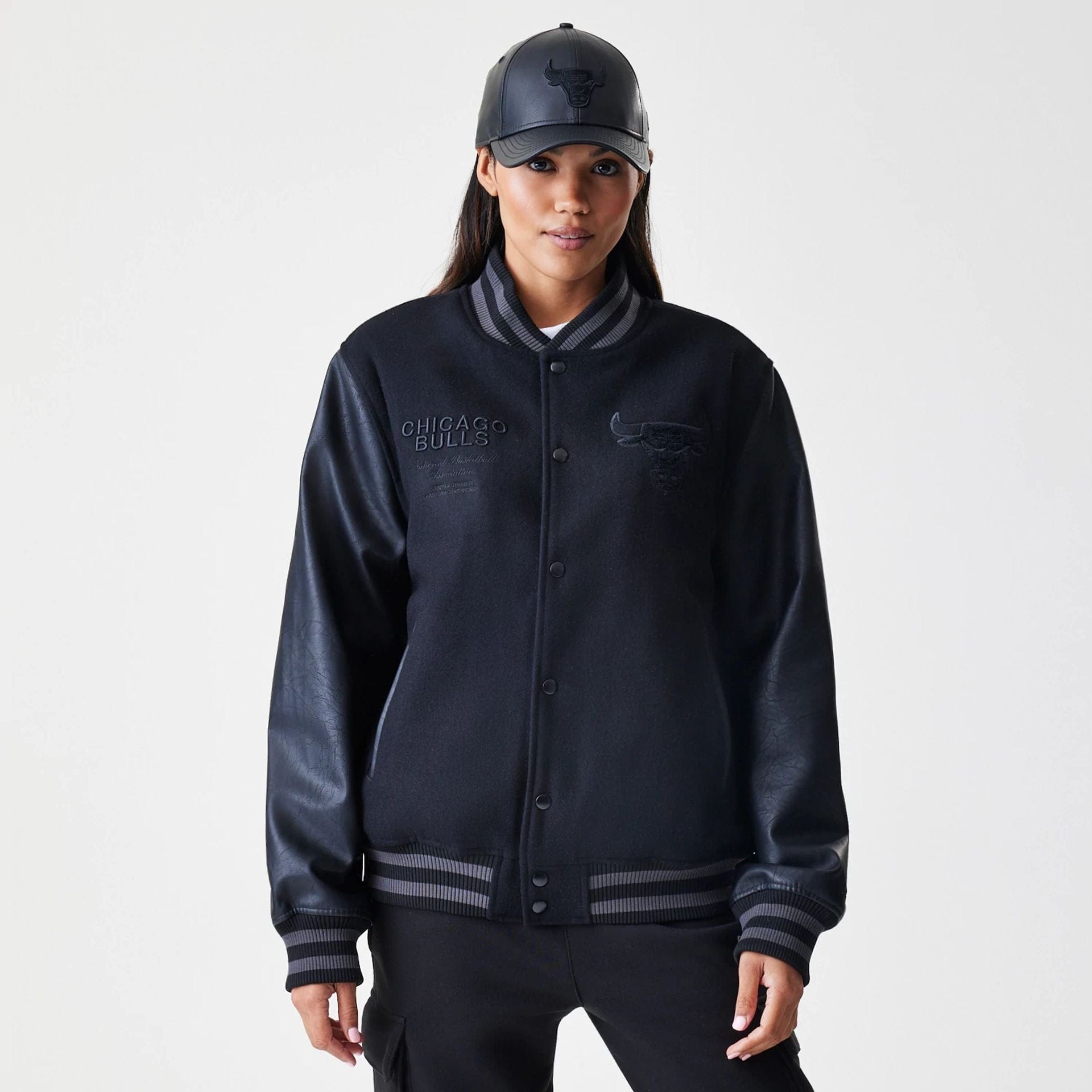 The Male model is wearing Chicago Bulls NBA Tonal Black Varsity Jacket  4