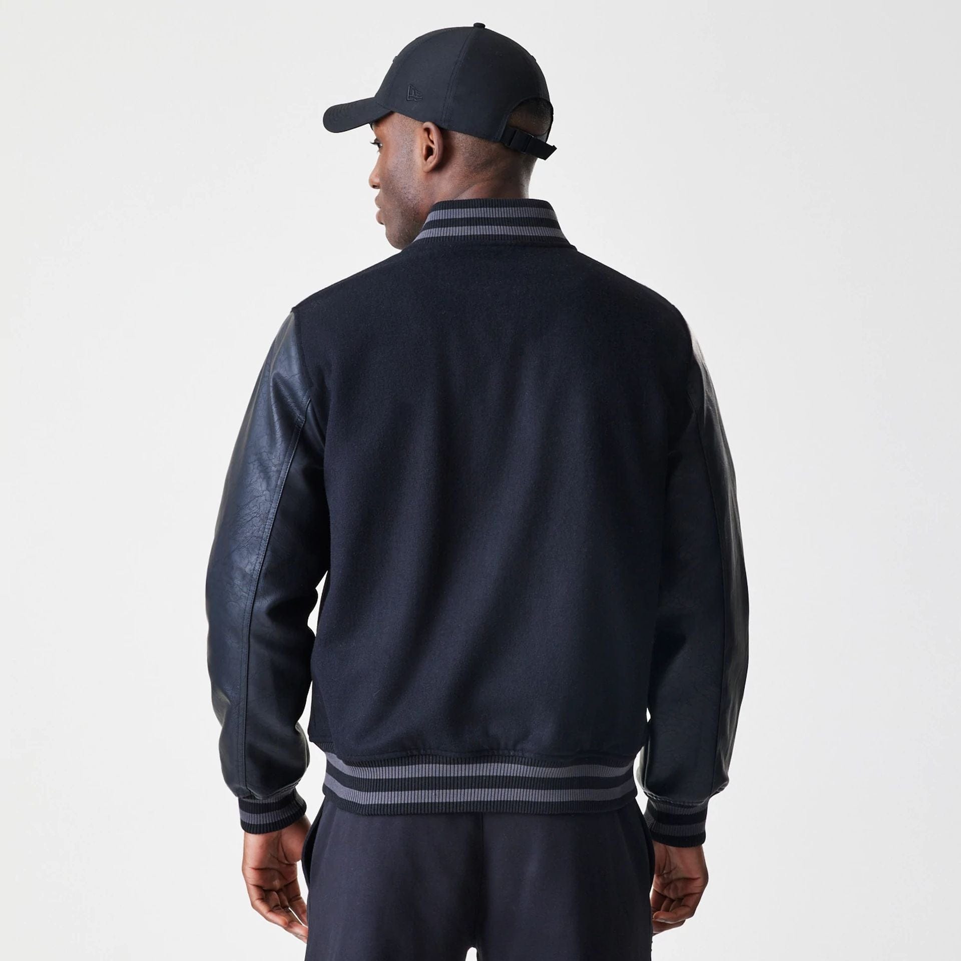 The Male model is wearing Chicago Bulls NBA Tonal Black Varsity Jacket  2