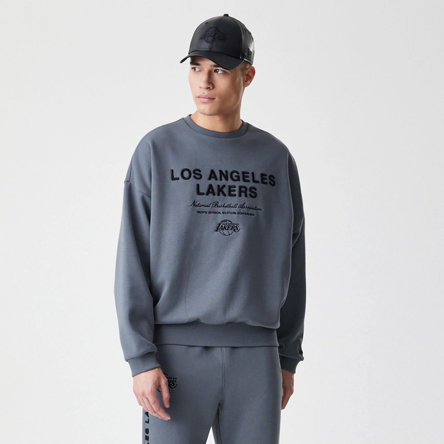 The Male model is wearing LA Lakers NBA Linear Dark Grey Crew Neck Sweater 4