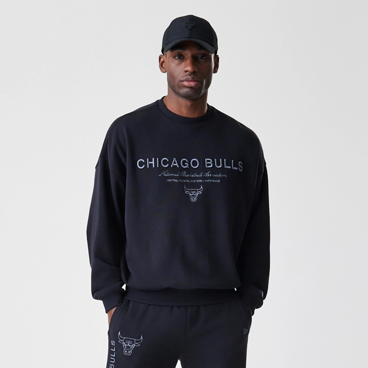 The Male model is wearing Chicago Bulls NBA Linear Black Crew Neck Sweater 3