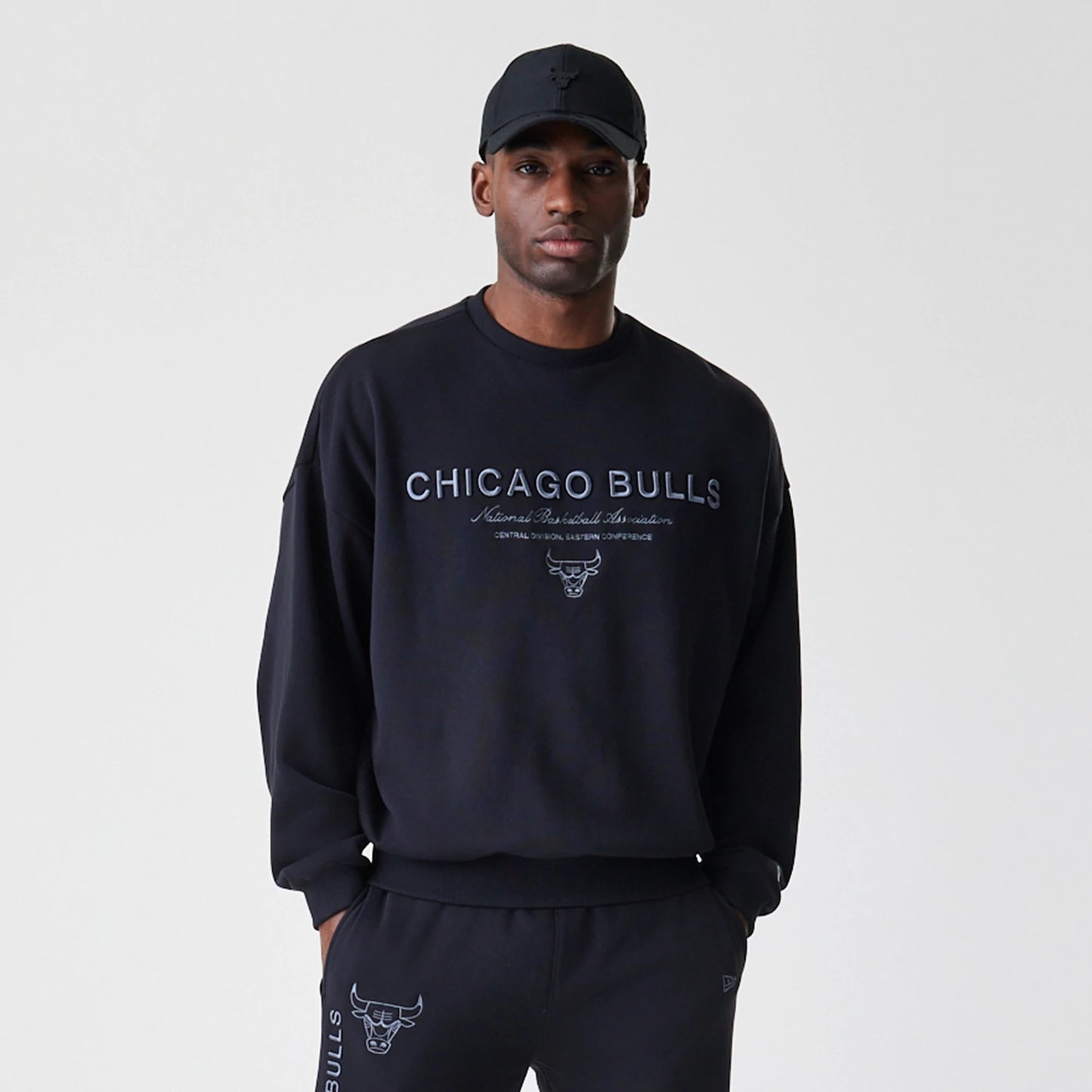 The Male model is wearing Chicago Bulls NBA Linear Black Crew Neck Sweater 3