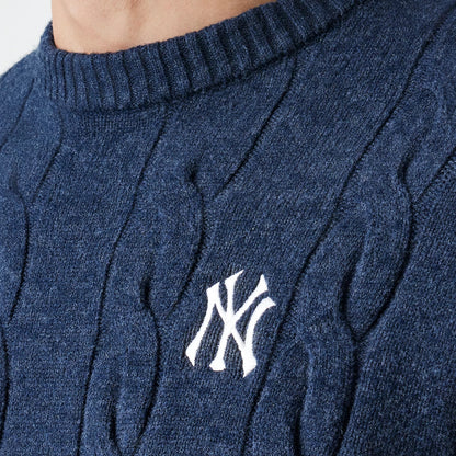New Era New York Yankees MLB Cable Knit Navy Knitted Sweater, close-up view showing the white embroidered NY logo on the textured cable knit pattern, with a ribbed crew neckline for a classic touch.