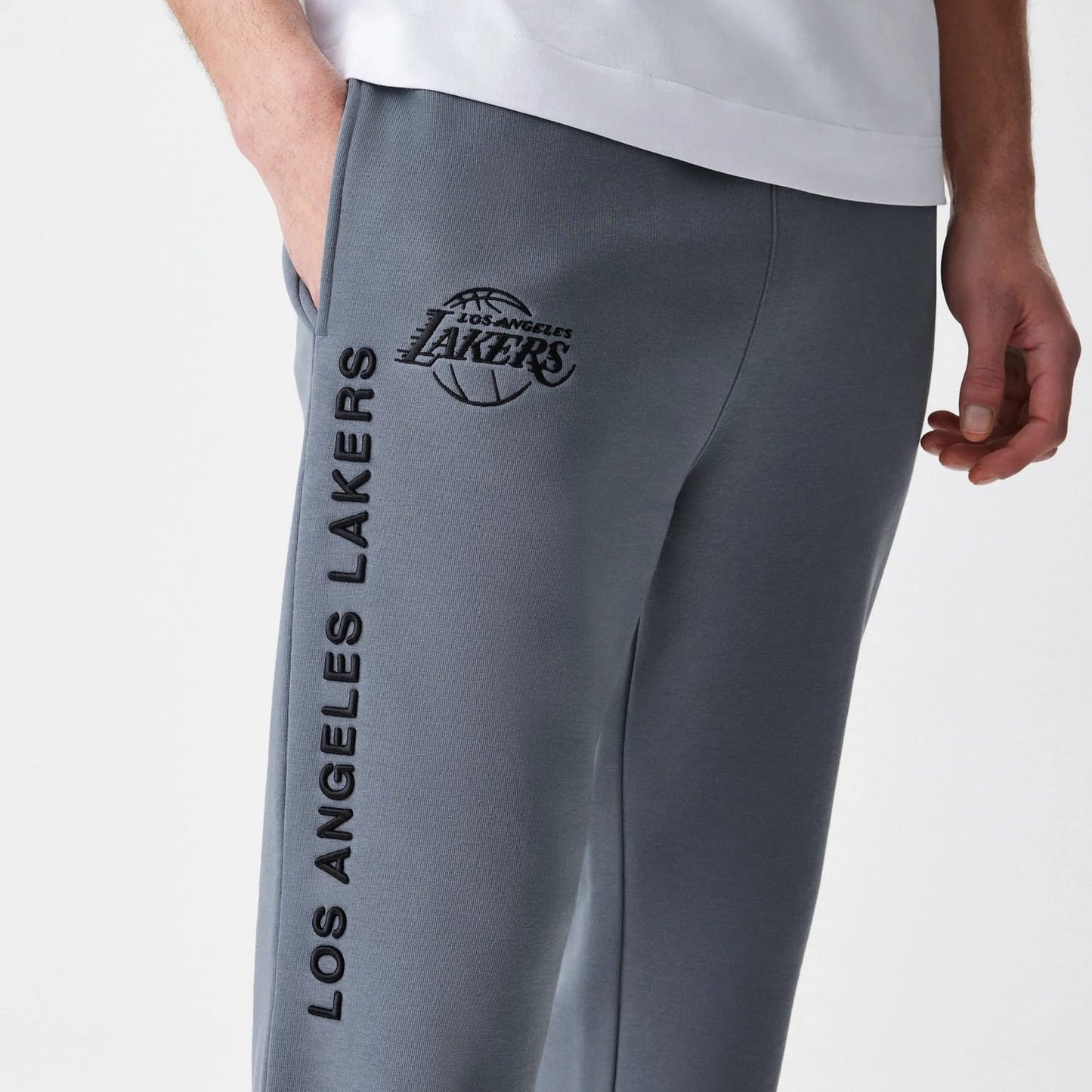 The Male model is wearing LA Lakers NBA Linear Dark Grey Straight Leg Joggers 7