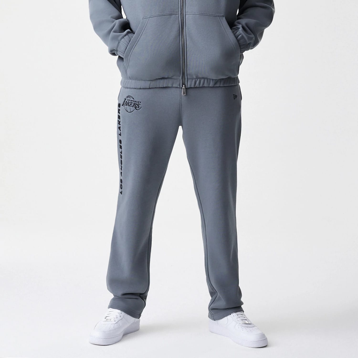 The Male model is wearing LA Lakers NBA Linear Dark Grey Straight Leg Joggers 5
