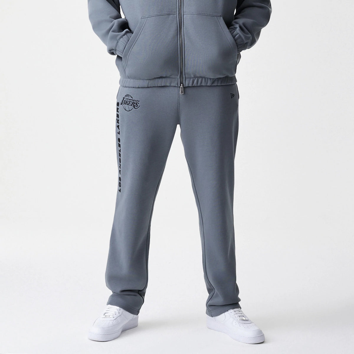 The Male model is wearing LA Lakers NBA Linear Dark Grey Straight Leg Joggers 5