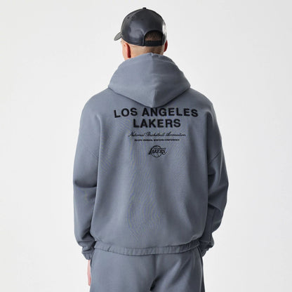 The Male model is wearing LA Lakers NBA Linear Dark Grey Oversized Full Zip Hoodie  2