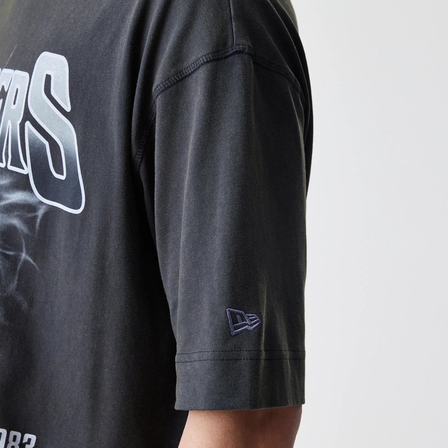 The Male model is wearing Las Vegas Raiders NFL Washed Boxy Dark Grey Oversized T-Shirt 5