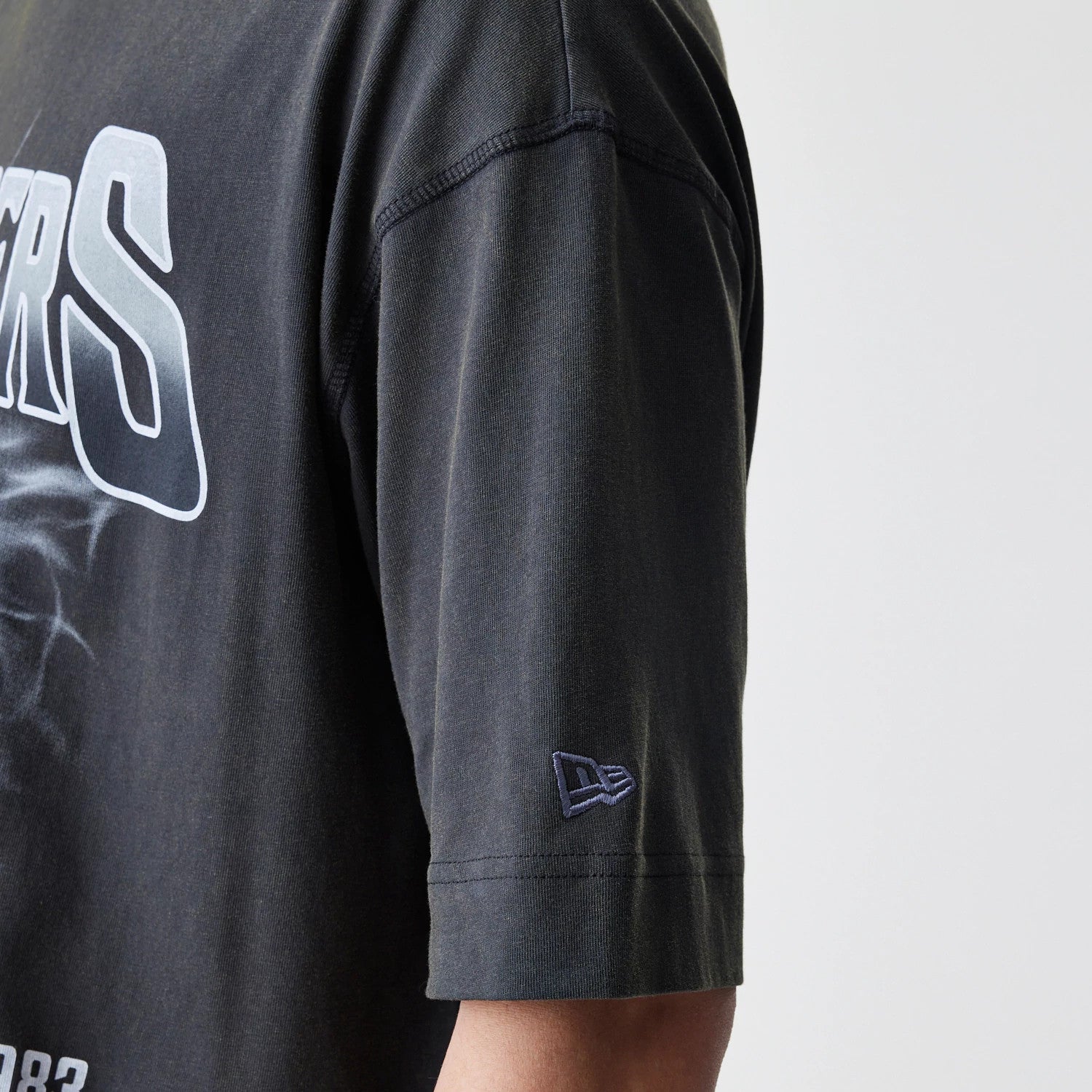 The Male model is wearing Las Vegas Raiders NFL Washed Boxy Dark Grey Oversized T-Shirt 5