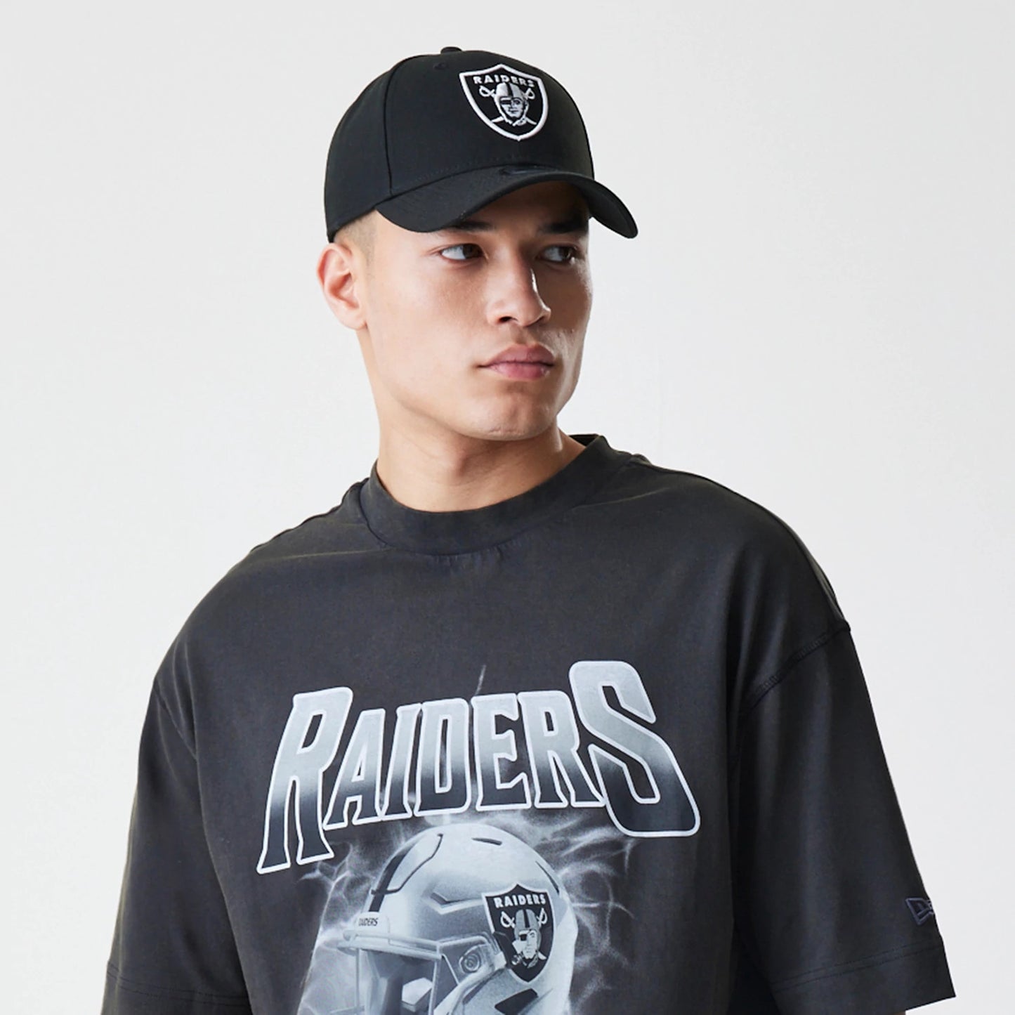The Male model is wearing Las Vegas Raiders NFL Washed Boxy Dark Grey Oversized T-Shirt 6